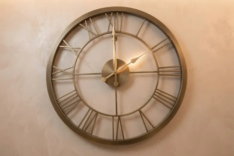 A brass wall clock at The Workshop