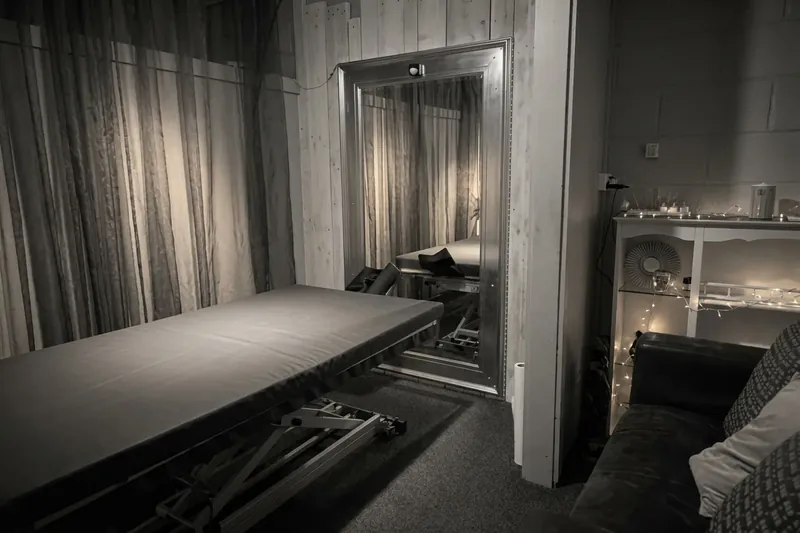 The pink tantric room at The Workshop, with a full-length mirror